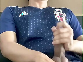 Cum shot Asian guy playing with his big cock in japanese football suit